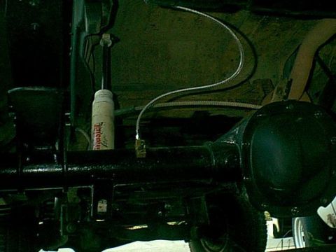 1983 Ford Bronco - the flex line went right in place of the stock rubber line. the axle vent goes thru the bottom of the disti block.