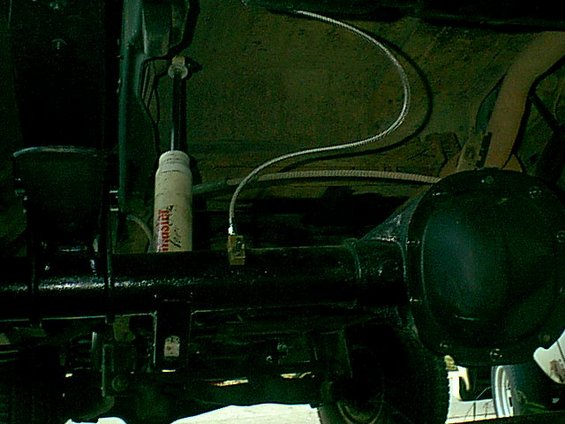 the flex line went right in place of the stock rubber line. the axle vent goes thru the bottom of the disti block.