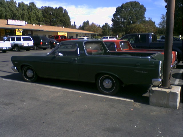 Dark green 1973 Ford Ranchero parked in a lot