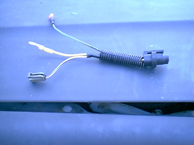 Here is my home made harness. i tossed a couple of the wires in the stock harness. the new uses 3 wires i soldered and heat shrank all connections.
