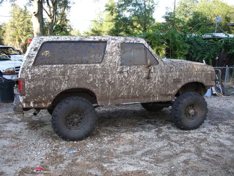 1989 Ford Bronco - This 1989 Ford Bronco is heavily covered in mud after off-roading.
