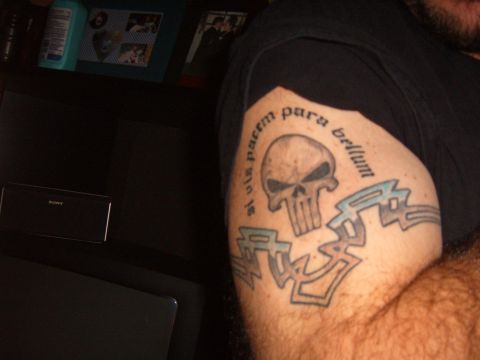 1993 Ford Bronco - A tattoo a skull and Latin text is visible on an arm.