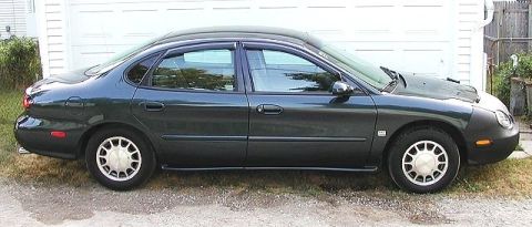 1998 Ford Taurus - Note the black third window. Guess that's my "signature" now -- did it to my Tempo too.