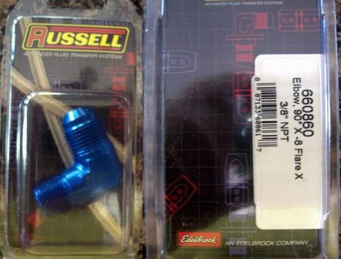1978 Ford Mustang II - Two packaged automotive fluid transfer fittings are shown, one from Russell and one from Edelbrock.