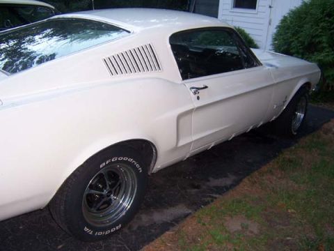 1968 Ford Mustang - This white coupe features distinctive louvers on the rear quarter panel and BFGoodrich Radial T/A tires.