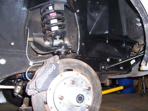 1968 Ford Mustang - Front suspension and brake assembly, likely from a classic car, with visible aftermarket parts.