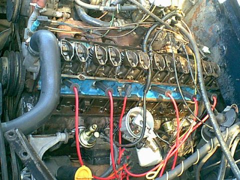 1983 Ford Bronco - Off came the fuel line from the pump to the carb then the valve cover and lifter valley cover.