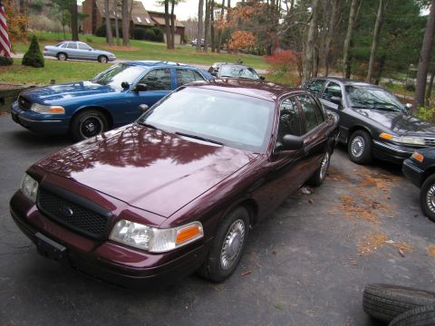 1991 Ford LTD Crown Victoria - Several Ford Crown Victoria sedans parked in a driveway.