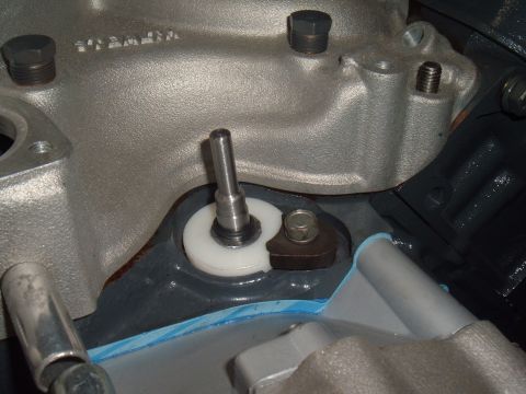 1971 Ford Ranchero - Engine manifold part with a metal shaft and white bushing visible.