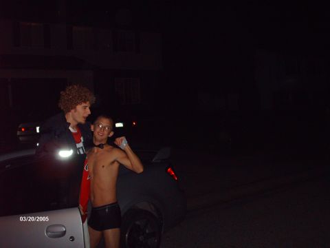 1995 Ford Probe - Two friends pose for a photo next to a car at night, with a date stamp of March 20, 2005.