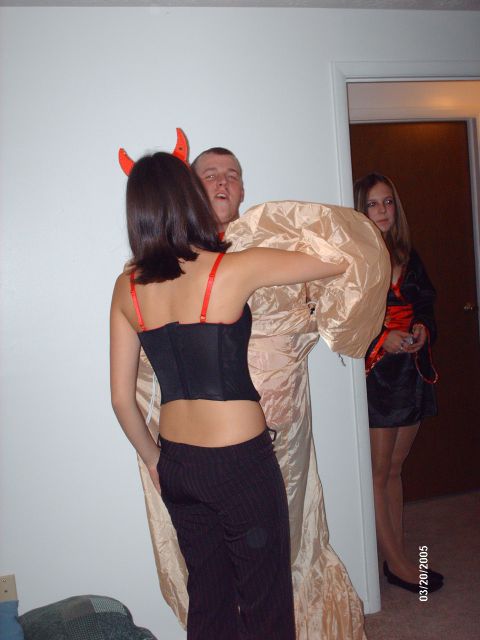 1995 Ford Probe - Three people in costumes pose for a photo during a Halloween celebration.