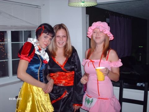 1995 Ford Probe - Three friends dressed in costumes pose for a photo indoors, with a date stamp of March 20, 2005.
