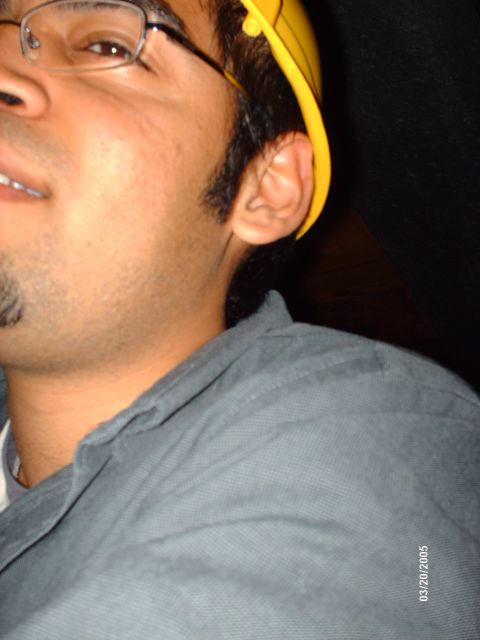 1995 Ford Probe - A person wearing glasses and a yellow hard hat is visible in this close-up photo.