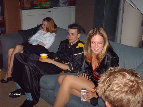 1995 Ford Probe - A group of friends are gathered indoors, some in costume, enjoying each other's company.