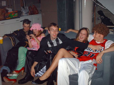 1995 Ford Probe - A group of friends in costumes pose for a photo on a couch during a Halloween party.