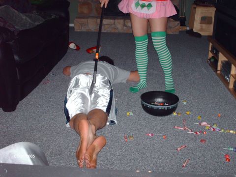 1995 Ford Probe - A person is on the floor with candy scattered around them, while another person stands over them.