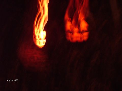 1995 Ford Probe - Abstract flames, one with a jack-o-lantern face, are illuminated against a dark background.