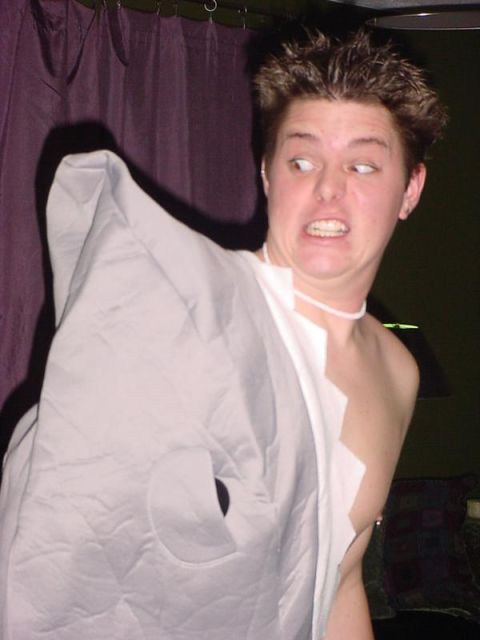 1995 Ford Probe - A person makes a funny face while wearing a grey costume that resembles a shark or fish.