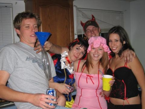 1995 Ford Probe - Friends dressed in costumes for a party, with one person using a funnel for drinking.