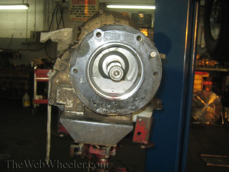 Rear of a removed transmission or transfer case showing splined output shaft and bolt flange