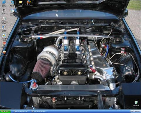 1991 Ford Probe - Customized engine bay a large turbocharger, intercooler, and braided lines.