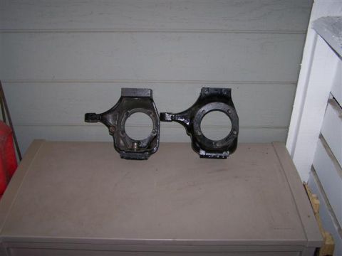 1995 Ford Bronco - Two steering knuckles are shown side-by-side.