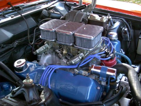 1972 Ford Ranchero - Close-up view of a modified V8 engine with chrome air cleaners and blue spark plug wires.