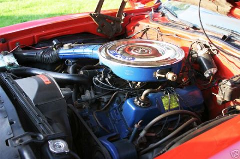 1972 Ford Ranchero - Close-up view of a vehicle's engine bay, blue painted components and a chrome air cleaner assembly.