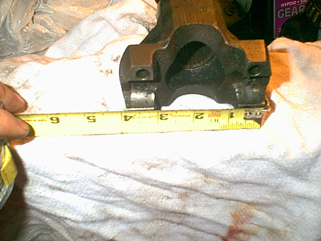 I got a new stronger rear drive shaft and this new shaft required a flang to install it not the yoke. so here is the stock yoke i removed from the rear transfer case.