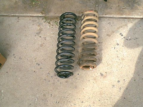 1983 Ford Bronco - here is the drivers side spring with the new spring.