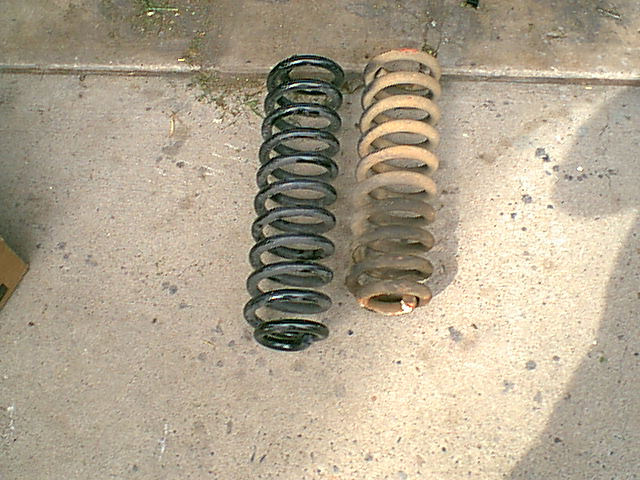 here is the drivers side spring with the new spring.