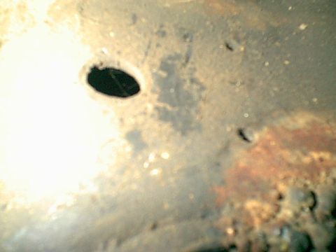 1983 Ford Bronco - These 2 holes were already in the frame. i just needed to open them up alittle.