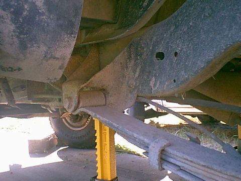 1983 Ford Bronco - Here is the way the rear springs looked before i did anything. you can see the spring clamp is coming apart and the rubber bushing is trash…