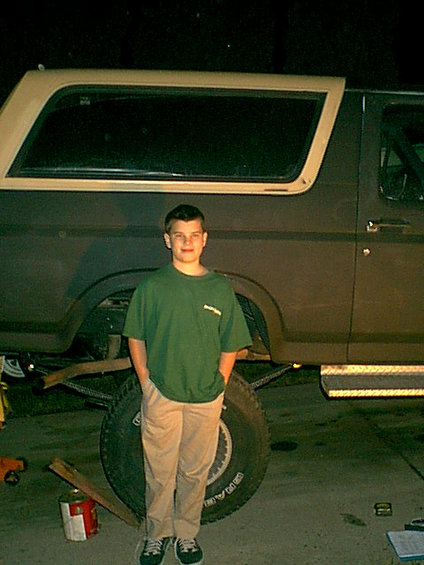 1983 Ford Bronco - josh next to the bronco at full droop.