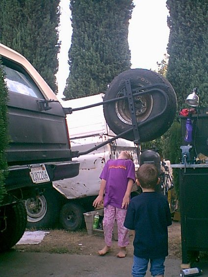 1983 Ford Bronco - Kids playing "Limbo" under the spare tire.