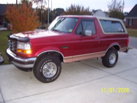 1994 Ford Bronco - This 1994 Ford Bronco is shown from the front three-quarter view, parked on a concrete driveway.