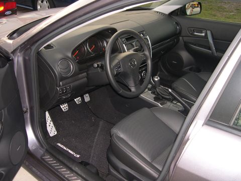 1997 Ford Probe - The interior of a MazdaSpeed 6 features black leather seats, a sporty steering wheel, and a detailed dashboard.