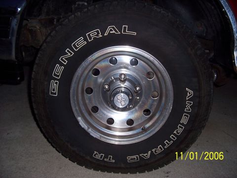 1994 Ford Bronco - A close-up shot focuses on the tire and wheel of a vehicle, with a date stamp visible.