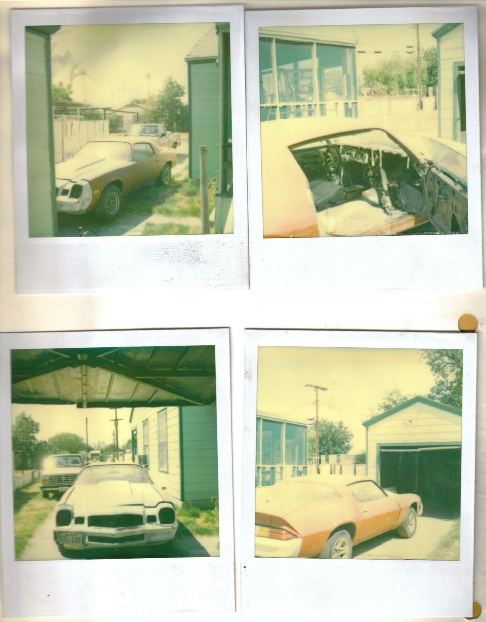 Two 1979 Chevrolet Camaros parked in a driveway, one orange and one white