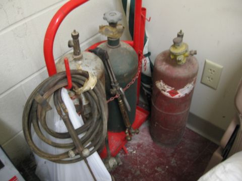 1974 Ford F-100 - Welding tanks and hoses are stored together with a torch.