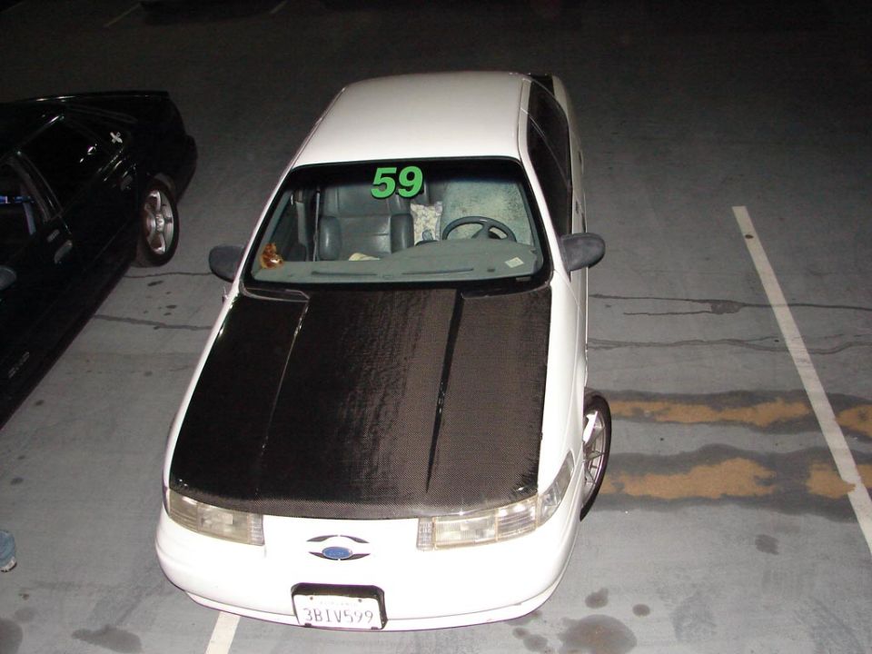 1992 Ford Taurus with black hood and racing number 59 on windshield