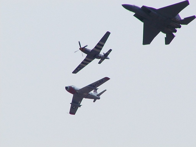 P-51 in lead, F-15 left wing, F-86 right wing.  It was cool to see those planes fly together. I had some video but it sucked.