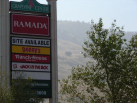 1992 Ford Taurus - Signage for businesses at Grapevine Center, including Ramada and Jack in the Box.