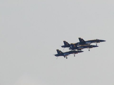 1998 Ford Taurus - Four fighter jets fly in formation during an airshow.