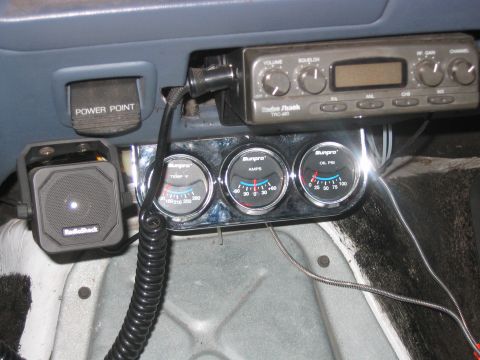 1992 Ford Bronco - Custom interior modifications include a CB radio and auxiliary gauges mounted below the dashboard.