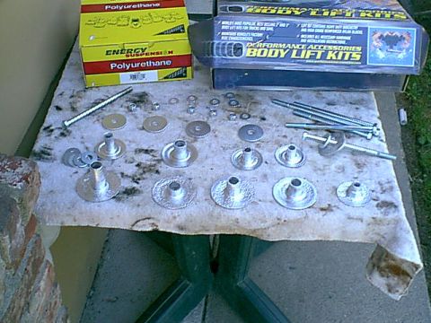 1983 Ford Bronco - Here are the old body mount shells. i cleaned and painted them to stop the rusting.. the poly mounts are in the back as is the 3" body lift.