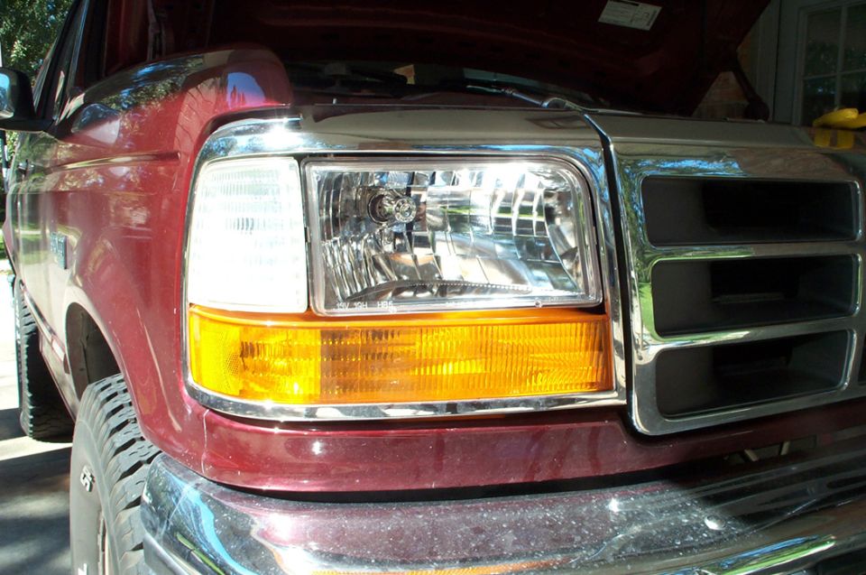 Red 1996 Ford Bronco front grille and headlight