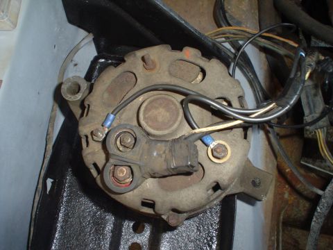 1967 Ford F-250 - An alternator, a key component of a vehicle's electrical system, is shown with its wiring.