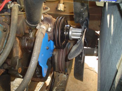 1967 Ford F-250 - Close-up view of engine components including fan, pulleys, and hoses.