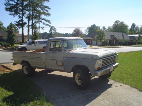 1967 Ford F-250 - 1967 Ford F-250 pickup truck with some rust and primer patches, parked outside.
